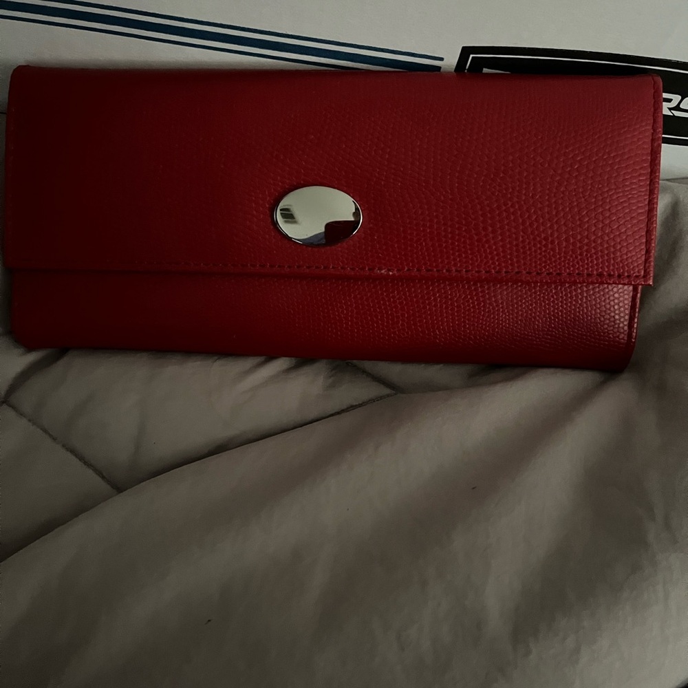 Red Leather Travel Bag with Silver Emblem